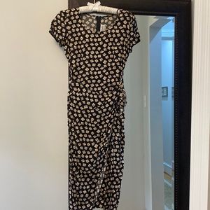 Beautiful dress wrap and ties at waist. Slit in back